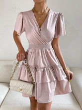 Robe imprimée à col surplis et manches bouffantes